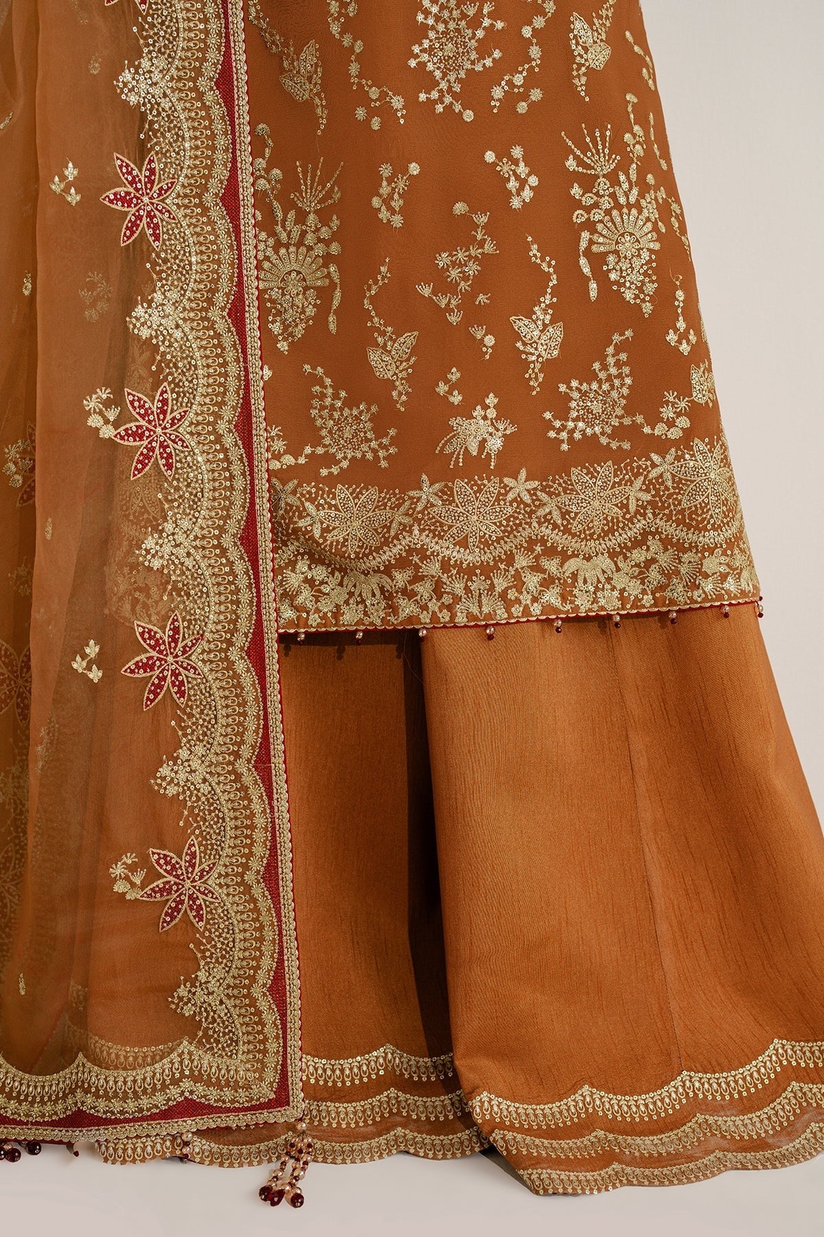 Chiffon and rawsilk elegance with intricate embroidery and organza dupatta. Ideal for formal wear and events. Make a bold style statement in UC-3077.