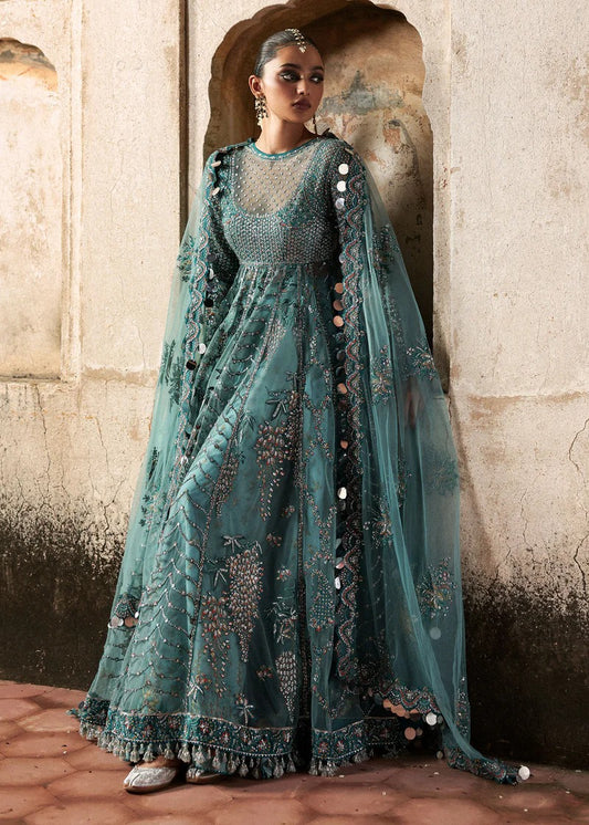 Dreamy ice blue net pishwas with sequin embroidery, silk lehnga, and chiffon dupatta. Unstitched luxury outfit that radiates elegance and grace.