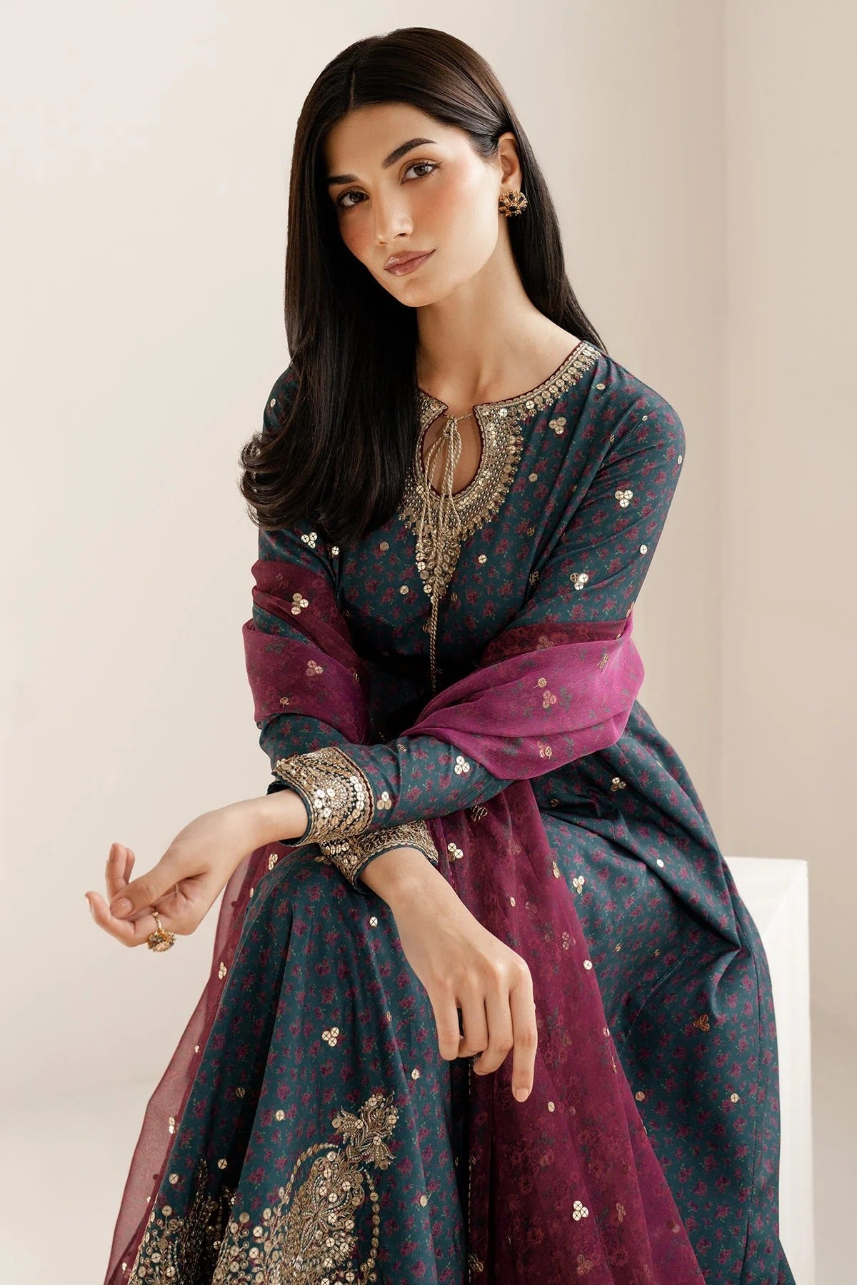 Discover UR-7058: a premium embroidered raw silk suit with chiffon dupatta and elegant borders. Perfect for formal, festive, or party occasions. Shop now!