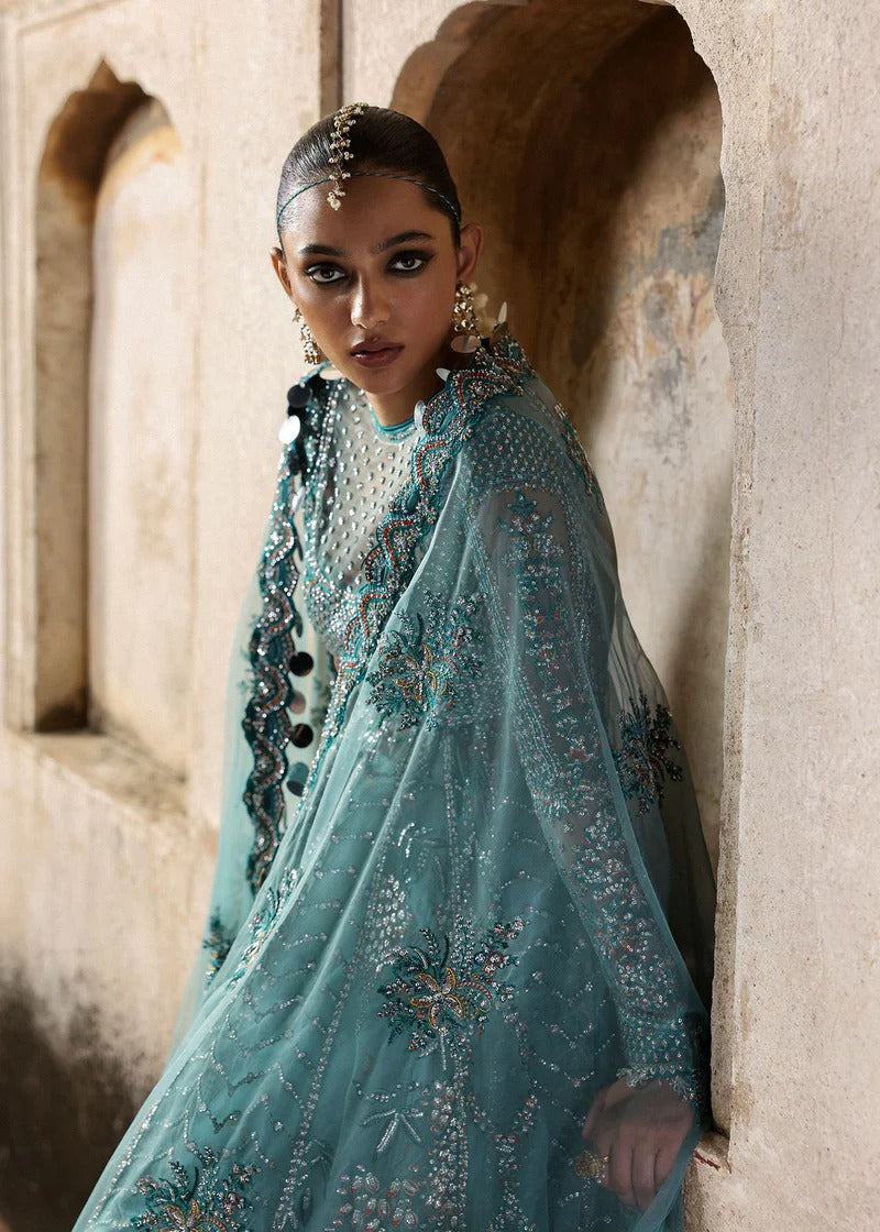 Dreamy ice blue net pishwas with sequin embroidery, silk lehnga, and chiffon dupatta. Unstitched luxury outfit that radiates elegance and grace.