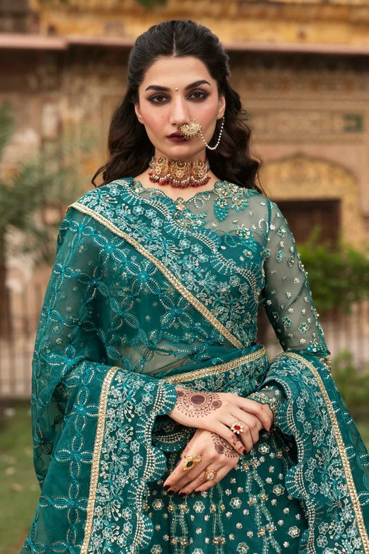 Elegant organza suit with embellished panels, blouse, sleeves & dupatta, paired with inner—crafted for timeless beauty, sophistication & luxury.