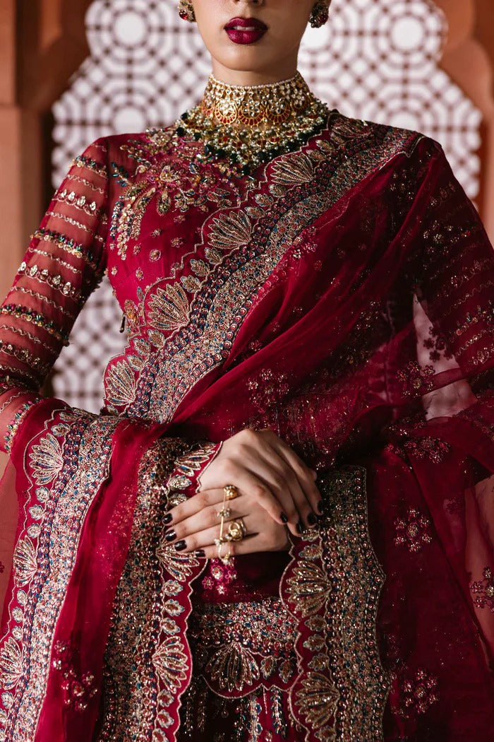 Graceful organza suit with embellished front panels, blouse, sleeves, dupatta & inner—crafted with fine embroidery for timeless elegance and charm.