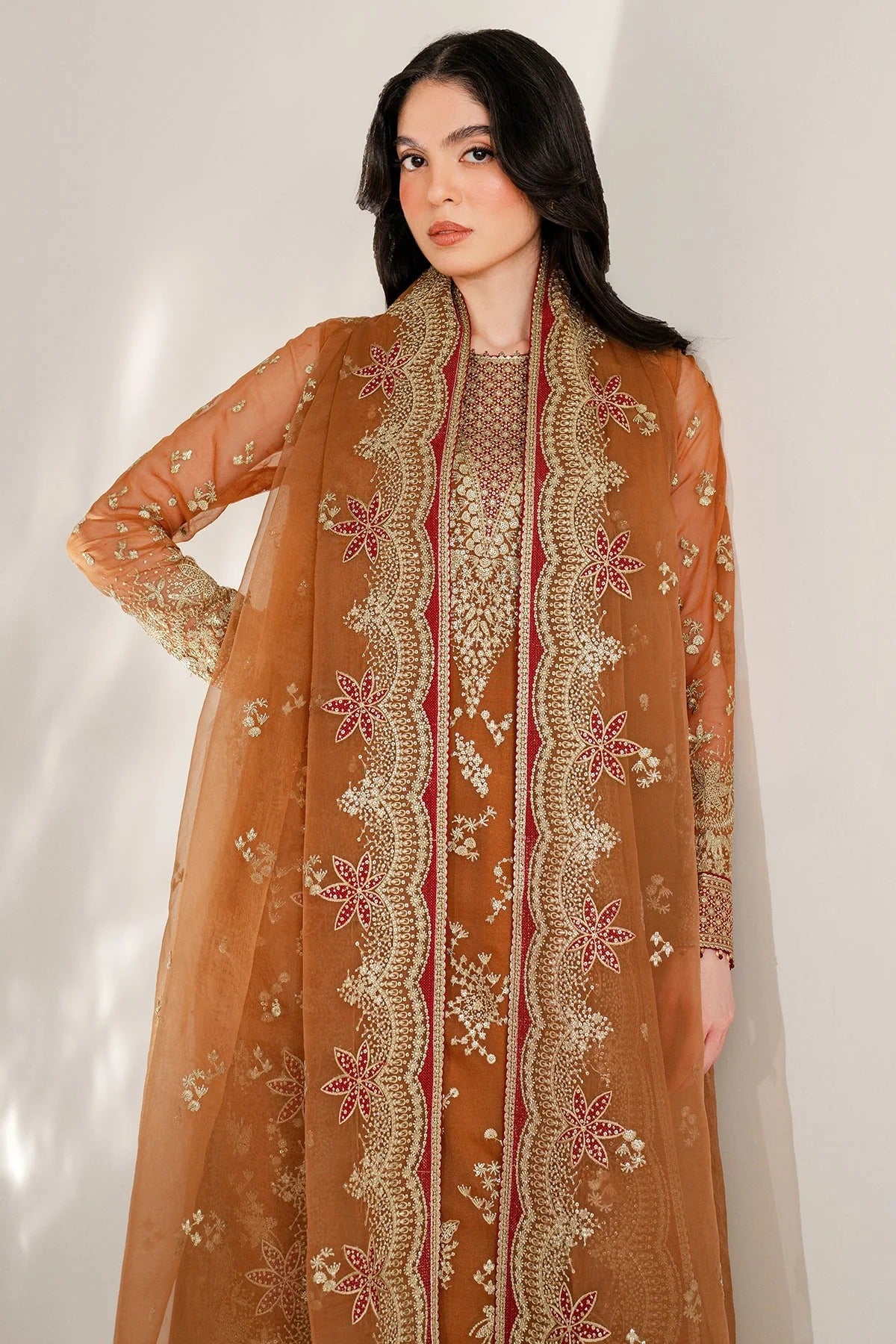 Chiffon and rawsilk elegance with intricate embroidery and organza dupatta. Ideal for formal wear and events. Make a bold style statement in UC-3077.