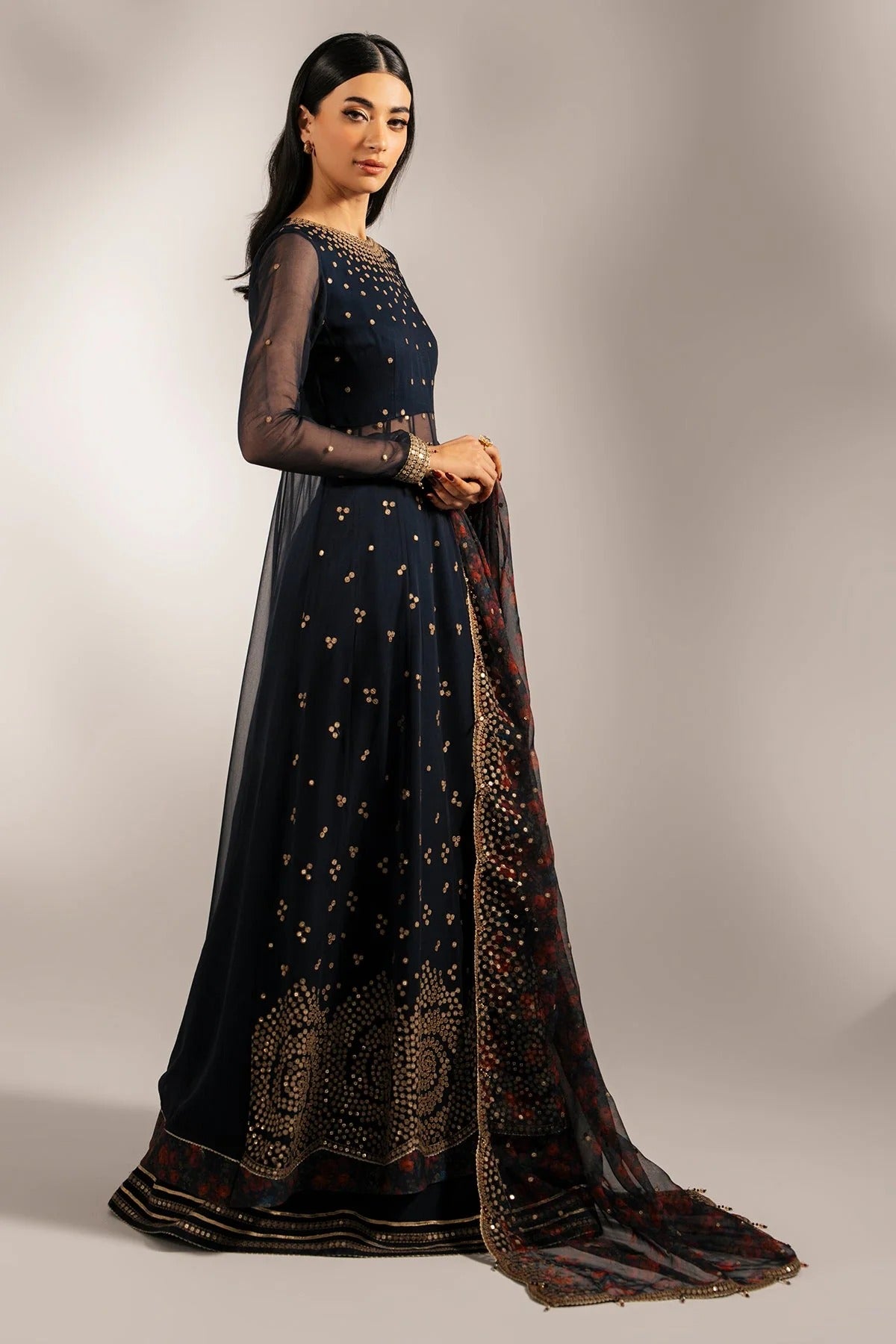 Intricately embroidered chiffon with digital print dupatta & rawsilk bottom—perfect for formal occasions. A luxurious look in every detail. Shop UC-3073 now!