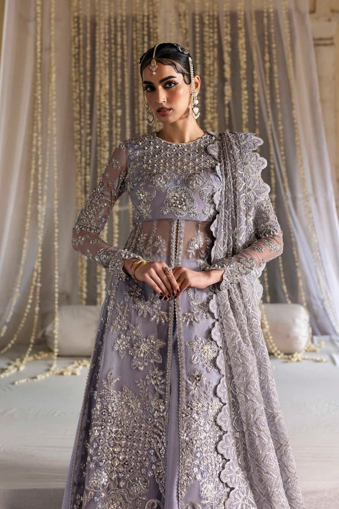 Elegant organza outfit with hand-embellished blouse, panels, sleeves, dupatta & raw silk trouser—crafted for timeless beauty and refined style.