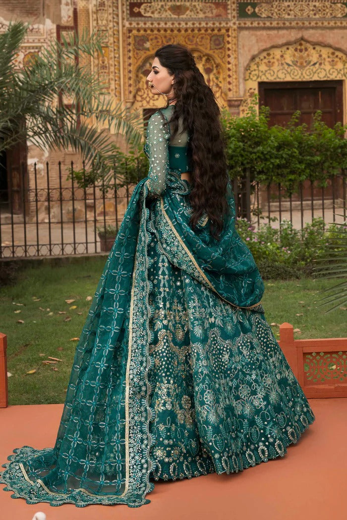 Elegant organza suit with embellished panels, blouse, sleeves & dupatta, paired with inner—crafted for timeless beauty, sophistication & luxury.