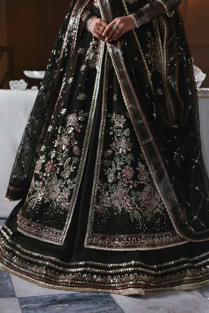 Stunning organza lehenga with embroidered panels, blouse, sleeves, dupatta & borders, paired with raw silk inner—crafted for regal elegance & style.
