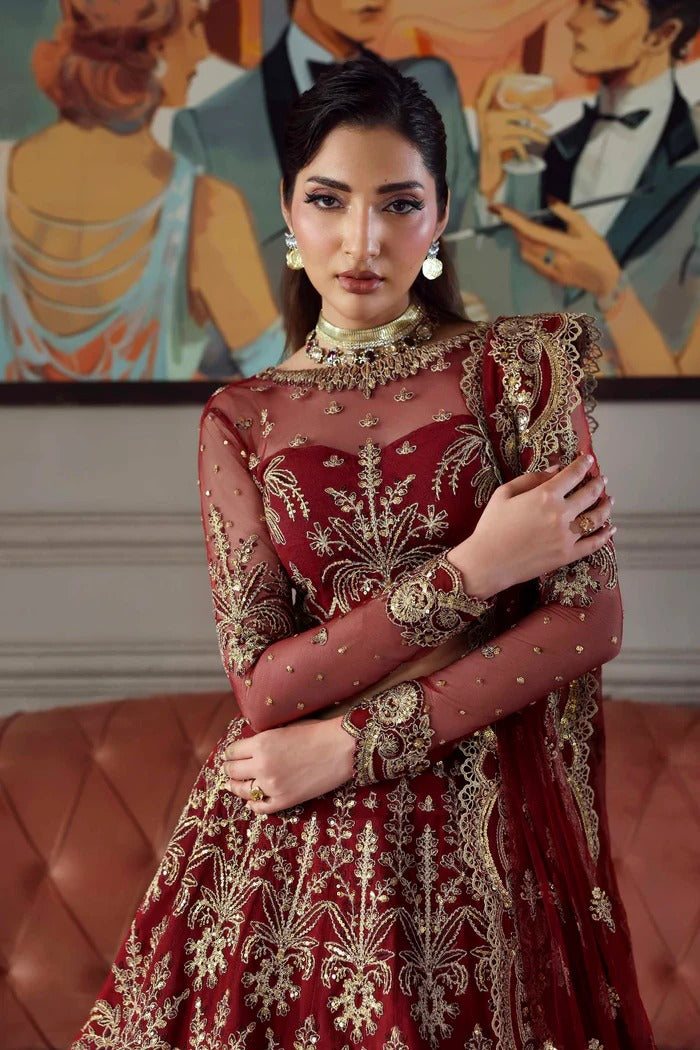 Elegant net dress featuring embroidered panels, blouse, neckline, sleeves & dupatta with borders, paired with silk inner—crafted for timeless grace.