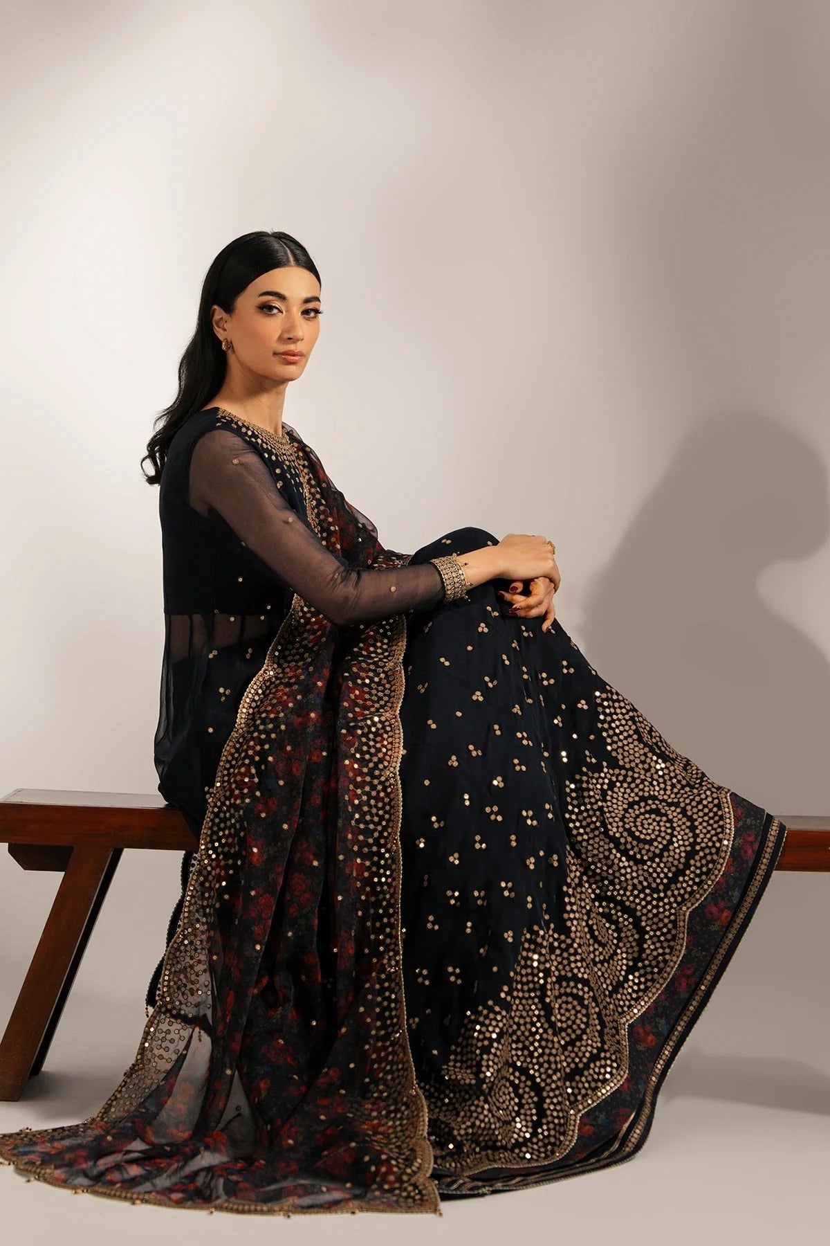 Intricately embroidered chiffon with digital print dupatta & rawsilk bottom—perfect for formal occasions. A luxurious look in every detail. Shop UC-3073 now!