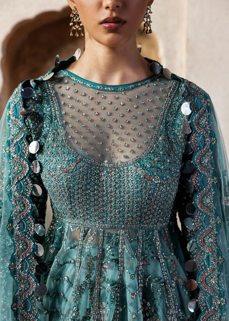 Dreamy ice blue net pishwas with sequin embroidery, silk lehnga, and chiffon dupatta. Unstitched luxury outfit that radiates elegance and grace.