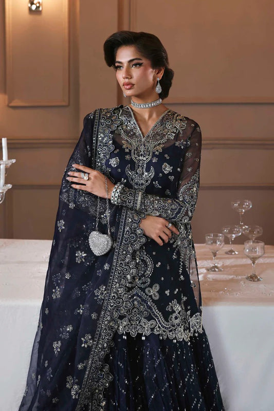 Elegant organza sharara outfit with embroidered front, back, sleeves & panels, paired with silk inner—crafted for a graceful and timeless look.