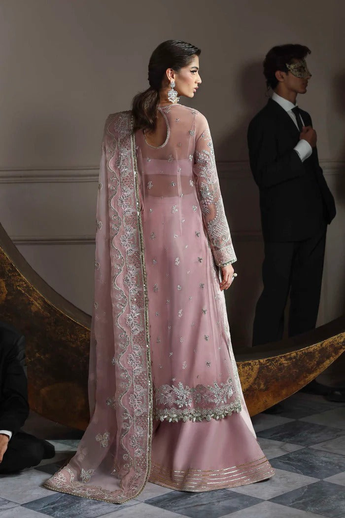 Elegant organza dress with embroidered panels, back, sleeves & dupatta, paired with silk inner and trouser—crafted for timeless charm and style.