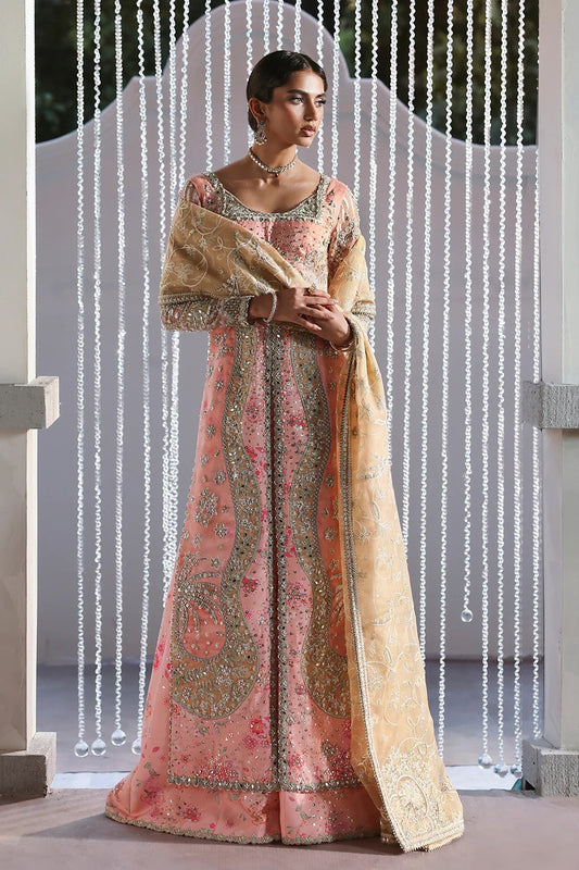 Beautiful printed pink silk suit with embroidered organza panels, embellished dupatta, and stylish sharara. Perfect for weddings, festive, and formal occasions.