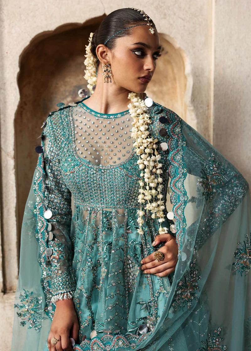 Dreamy ice blue net pishwas with sequin embroidery, silk lehnga, and chiffon dupatta. Unstitched luxury outfit that radiates elegance and grace.