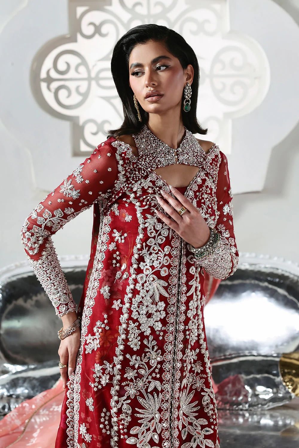 Stunning Crimson Red suit featuring embroidered organza panels, hand embellishments, silk trouser, and printed organza dupatta with elegant details.