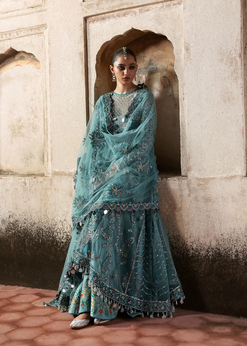 Dreamy ice blue net pishwas with sequin embroidery, silk lehnga, and chiffon dupatta. Unstitched luxury outfit that radiates elegance and grace.