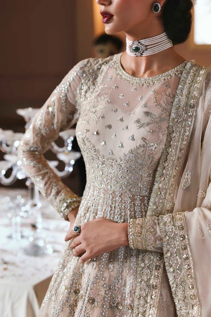 Chic organza dress featuring embroidered panels, blouse, sleeves & dupatta, paired with raw silk inner—crafted for timeless elegance and style.
