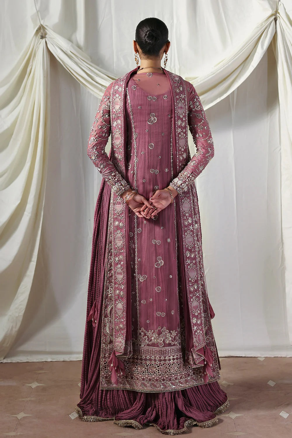Stylish mauve silk gown featuring embroidered organza panels, embellished dupatta, and crushed inner gown. A graceful ensemble perfect for weddings & festive wear.