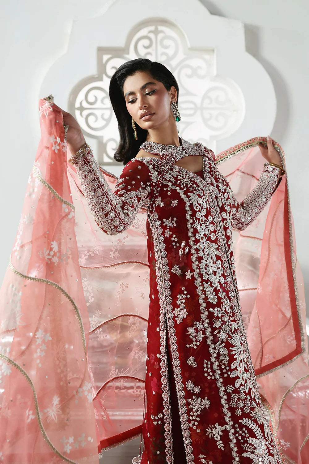 Stunning Crimson Red suit featuring embroidered organza panels, hand embellishments, silk trouser, and printed organza dupatta with elegant details.