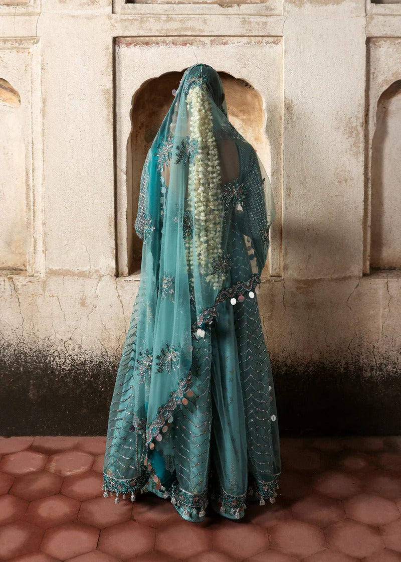 Dreamy ice blue net pishwas with sequin embroidery, silk lehnga, and chiffon dupatta. Unstitched luxury outfit that radiates elegance and grace.