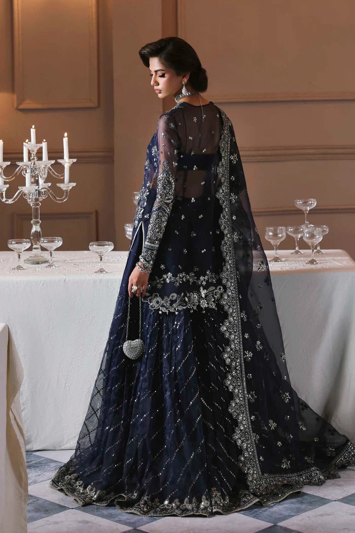 Elegant organza sharara outfit with embroidered front, back, sleeves & panels, paired with silk inner—crafted for a graceful and timeless look.