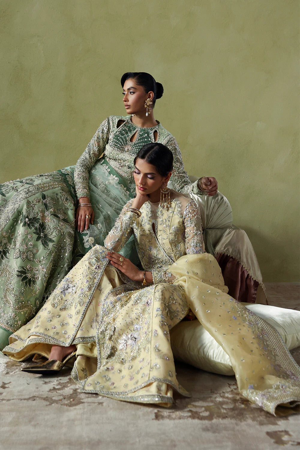 Graceful butter yellow silk suit with embroidered organza panels, embellished dupatta, and printed silk trousers. A stunning choice for festive and formal occasions.