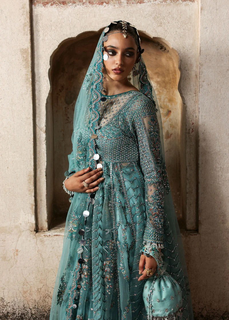 Dreamy ice blue net pishwas with sequin embroidery, silk lehnga, and chiffon dupatta. Unstitched luxury outfit that radiates elegance and grace.