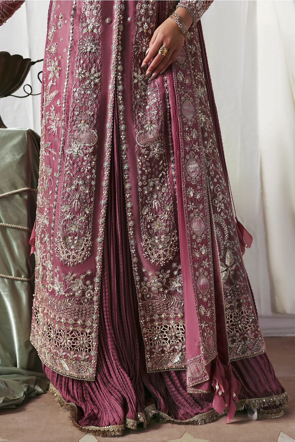 Stylish mauve silk gown featuring embroidered organza panels, embellished dupatta, and crushed inner gown. A graceful ensemble perfect for weddings & festive wear.