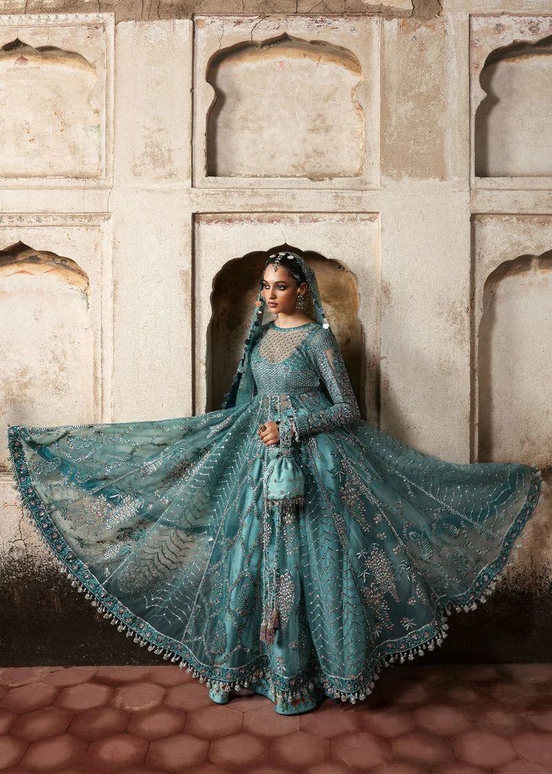 Dreamy ice blue net pishwas with sequin embroidery, silk lehnga, and chiffon dupatta. Unstitched luxury outfit that radiates elegance and grace.