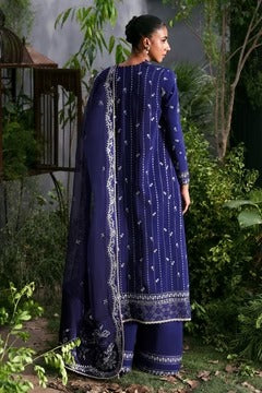 Sophisticated navy blue silk suit with embroidered panels, elegant organza dupatta, and silk trouser. Perfect for festive and formal occasion