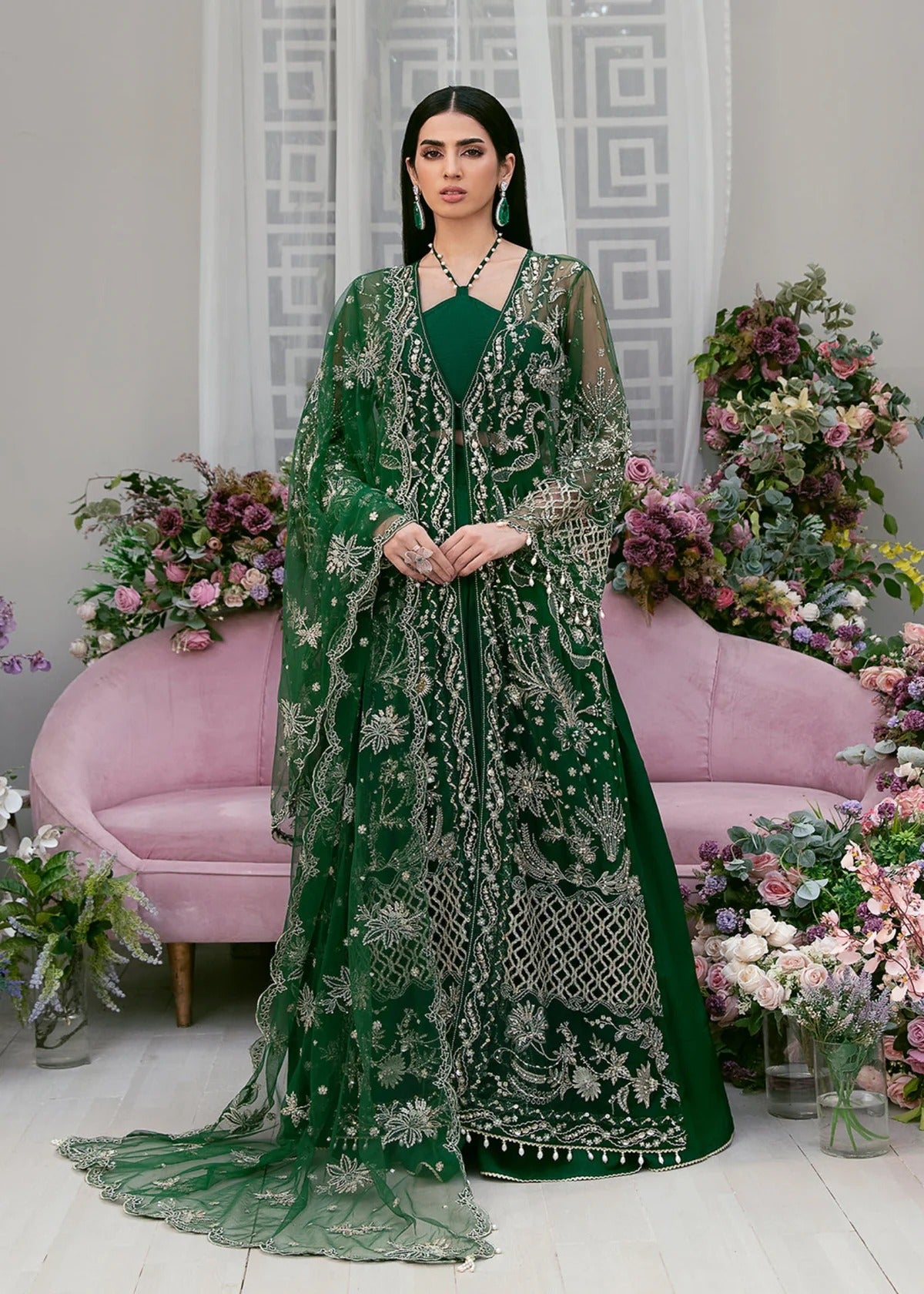 Luxury poly net embroidered suit with hand-embellished panels, cutwork sleeves, organza borders, embroidered dupatta, and raw silk trouser fabric.
