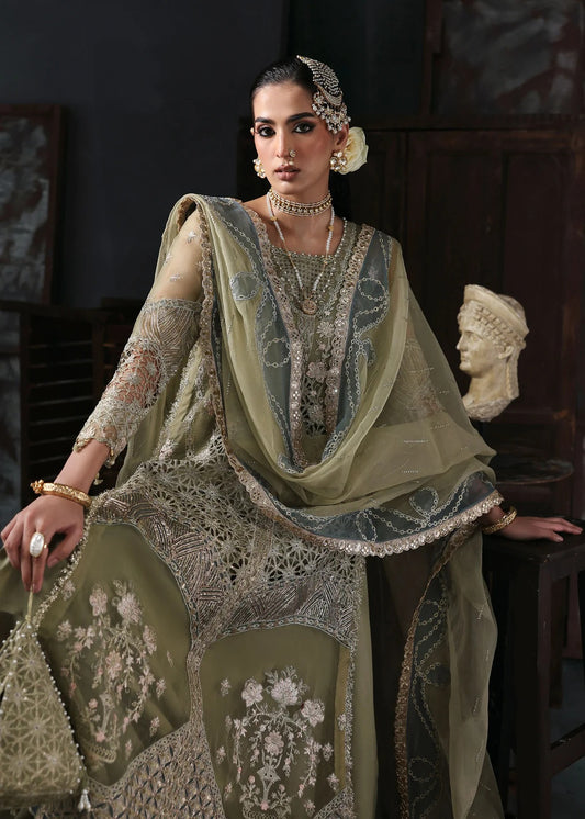 Graceful olive green organza suit with dori work, cutwork neckline, embroidered dupatta, and raw silk trouser a perfect choice for festive elegance.