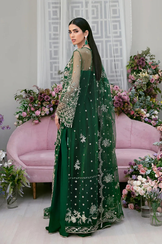 Luxury poly net embroidered suit with hand-embellished panels, cutwork sleeves, organza borders, embroidered dupatta, and raw silk trouser fabric.