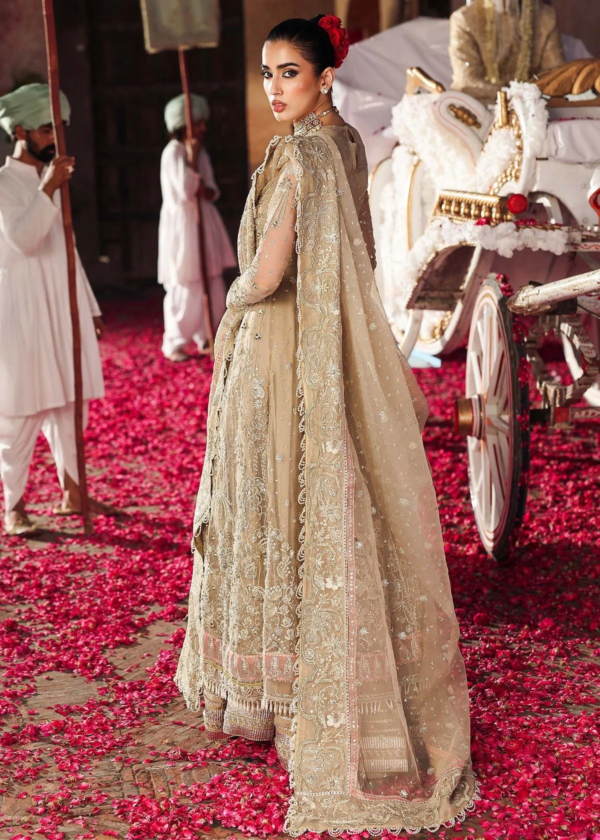 Elegant skin-golden formal outfit featuring hand-embroidered organza shirt, embellished dupatta with 4-side border, and raw silk trouser for a timeless look.
