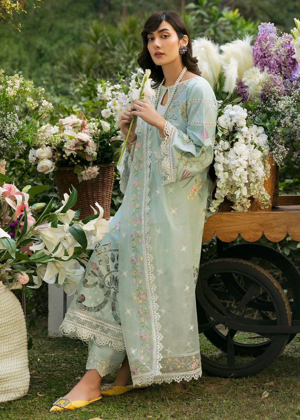 Elevate your style with this sky blue embroidered lawn suit featuring hand-work neckline, chikan-kari sleeves, net dupatta, and cotton trouser.