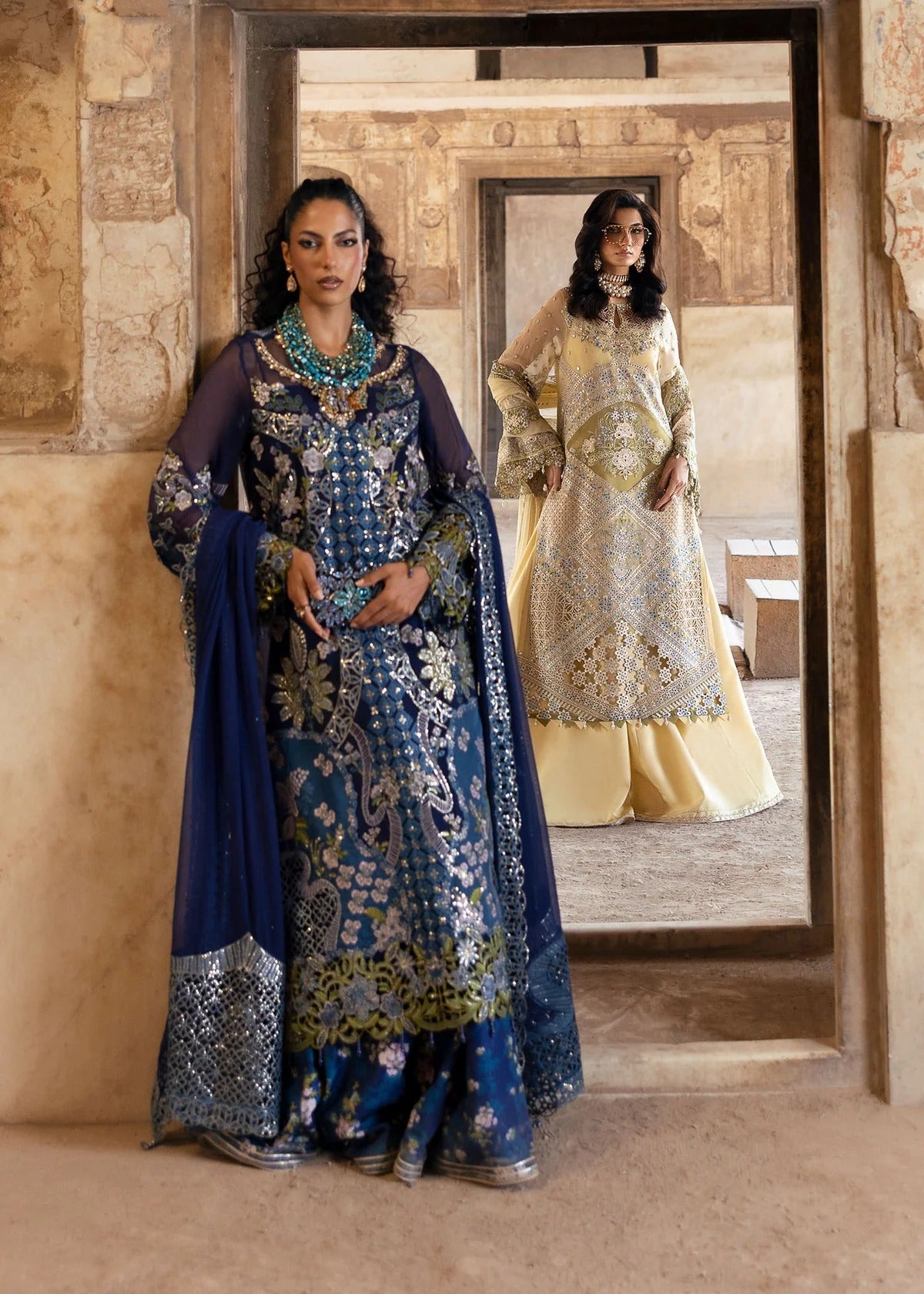 Stunning chiffon embroidered suit with hand-embellished neckline, cutwork motifs, diamante dupatta, and printed raw silk trouser for festive elegance.