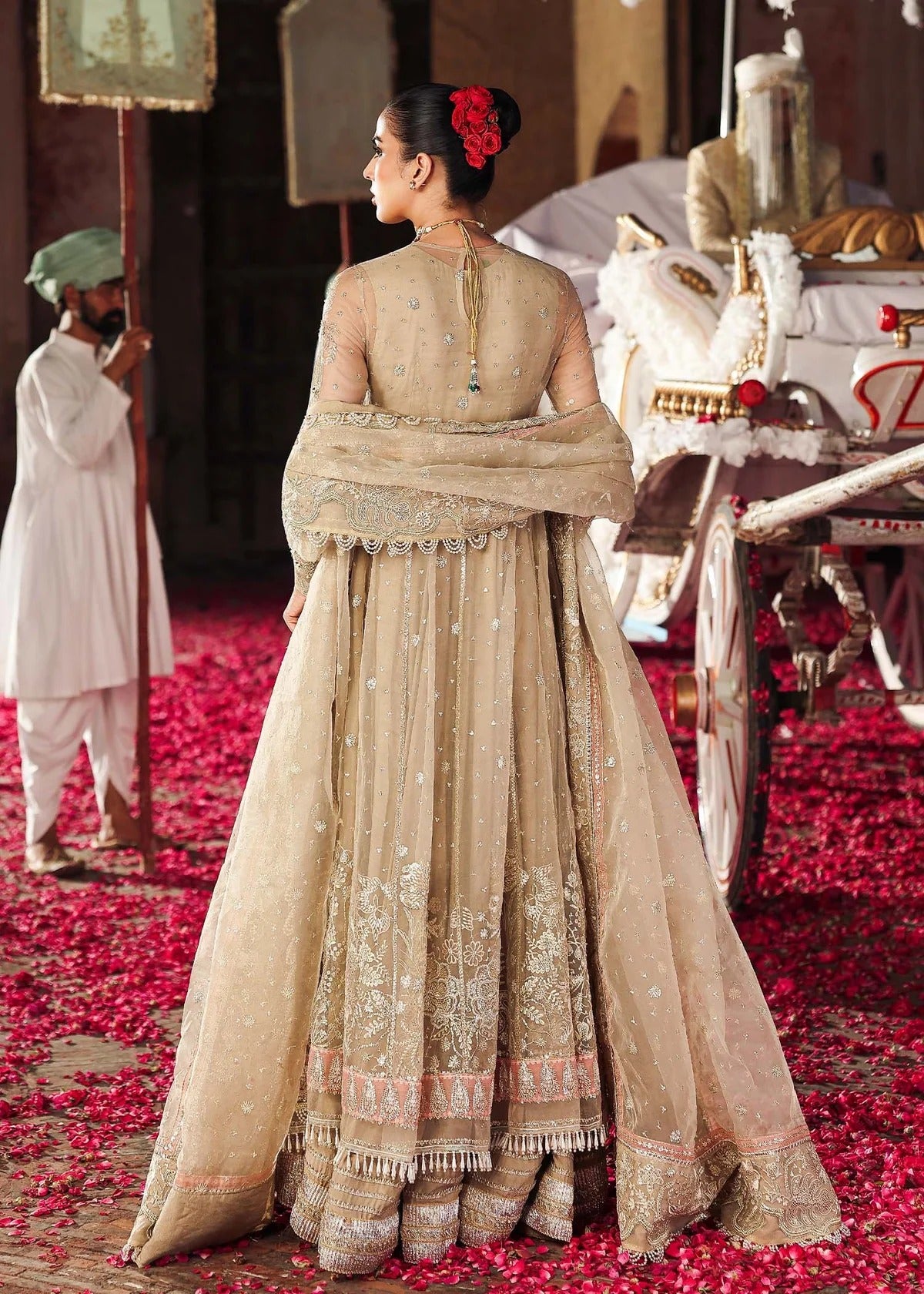 Elegant skin-golden formal outfit featuring hand-embroidered organza shirt, embellished dupatta with 4-side border, and raw silk trouser for a timeless look.