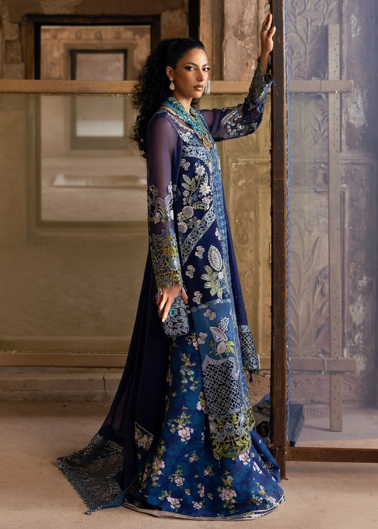 Stunning chiffon embroidered suit with hand-embellished neckline, cutwork motifs, diamante dupatta, and printed raw silk trouser for festive elegance.