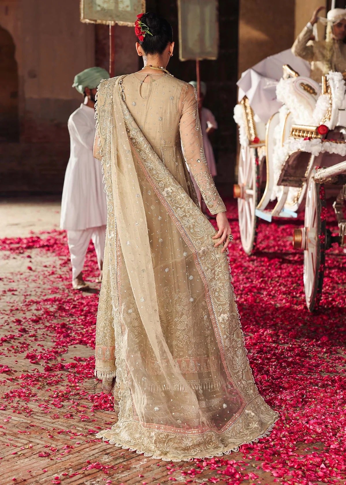 Elegant skin-golden formal outfit featuring hand-embroidered organza shirt, embellished dupatta with 4-side border, and raw silk trouser for a timeless look.