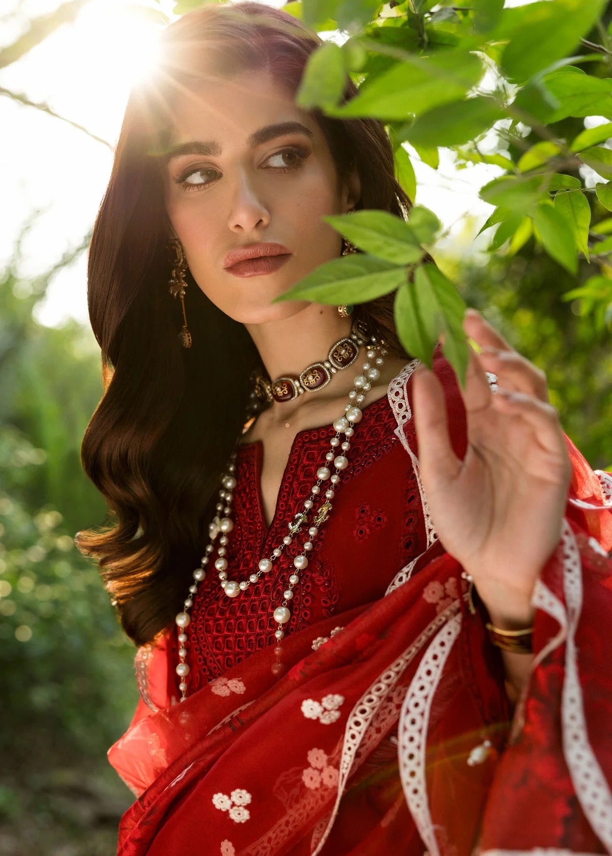 Stun in this maroon embroidered lawn suit with hand-work neckline, chikan-kari panels, 3D flowers, monar dupatta, and cotton trouser.