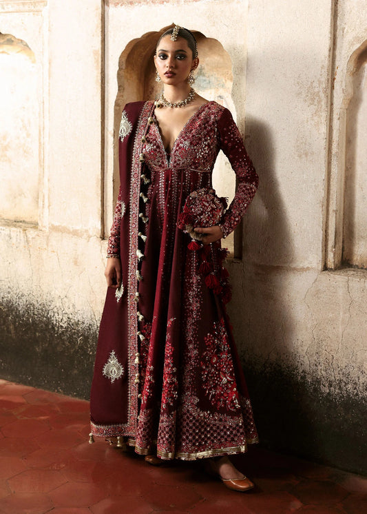 Elegant burgundy and maroon Korean raw silk pishwas with rich embroidery and matching churidar. Unstitched luxury outfit for timeless royal grace.