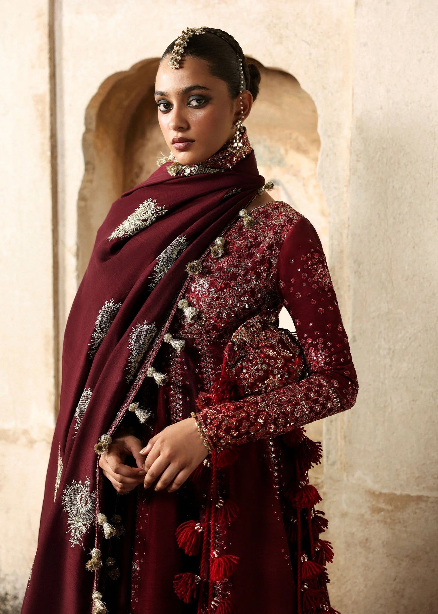 Elegant burgundy and maroon Korean raw silk pishwas with rich embroidery and matching churidar. Unstitched luxury outfit for timeless royal grace.