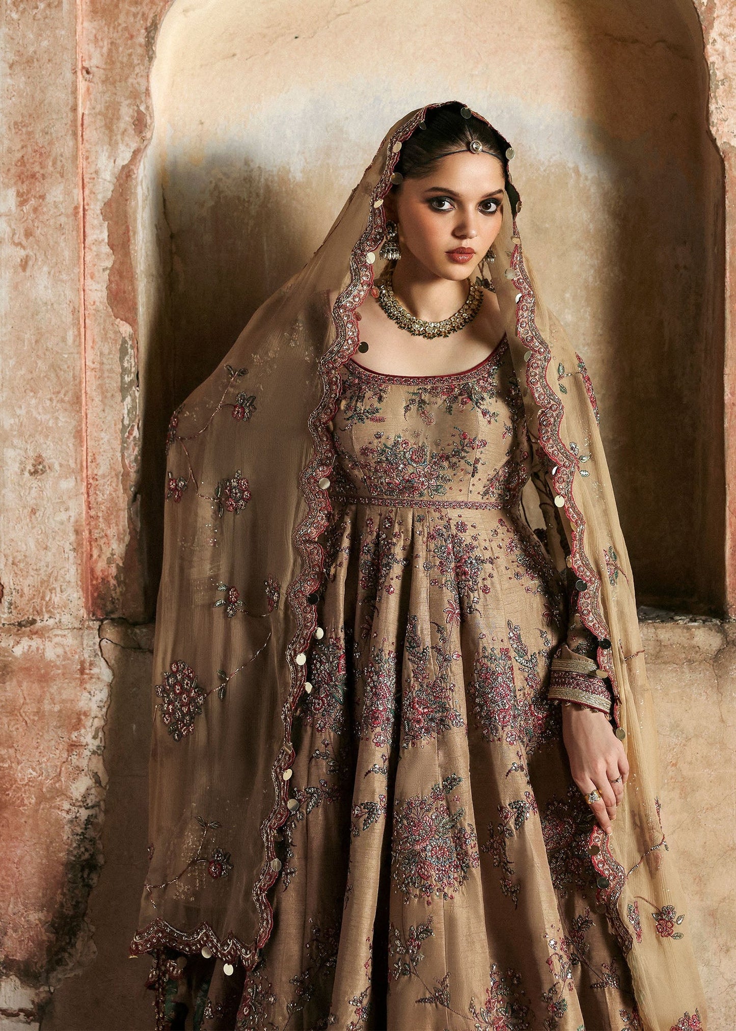 Graceful beige Korean raw silk pishwas with maroon churidar and chiffon dupatta. Elegant unstitched outfit perfect for weddings and festive wear.