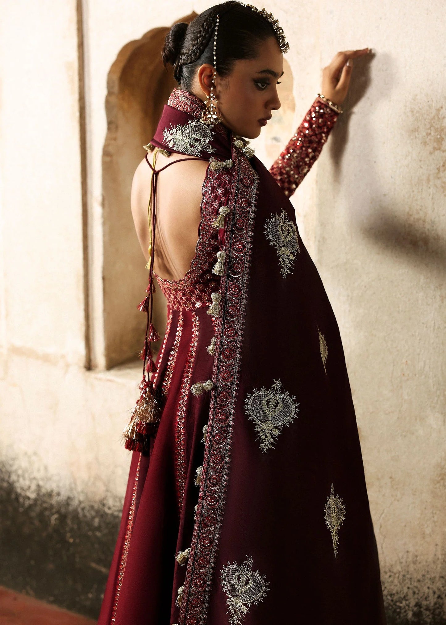Elegant burgundy and maroon Korean raw silk pishwas with rich embroidery and matching churidar. Unstitched luxury outfit for timeless royal grace.