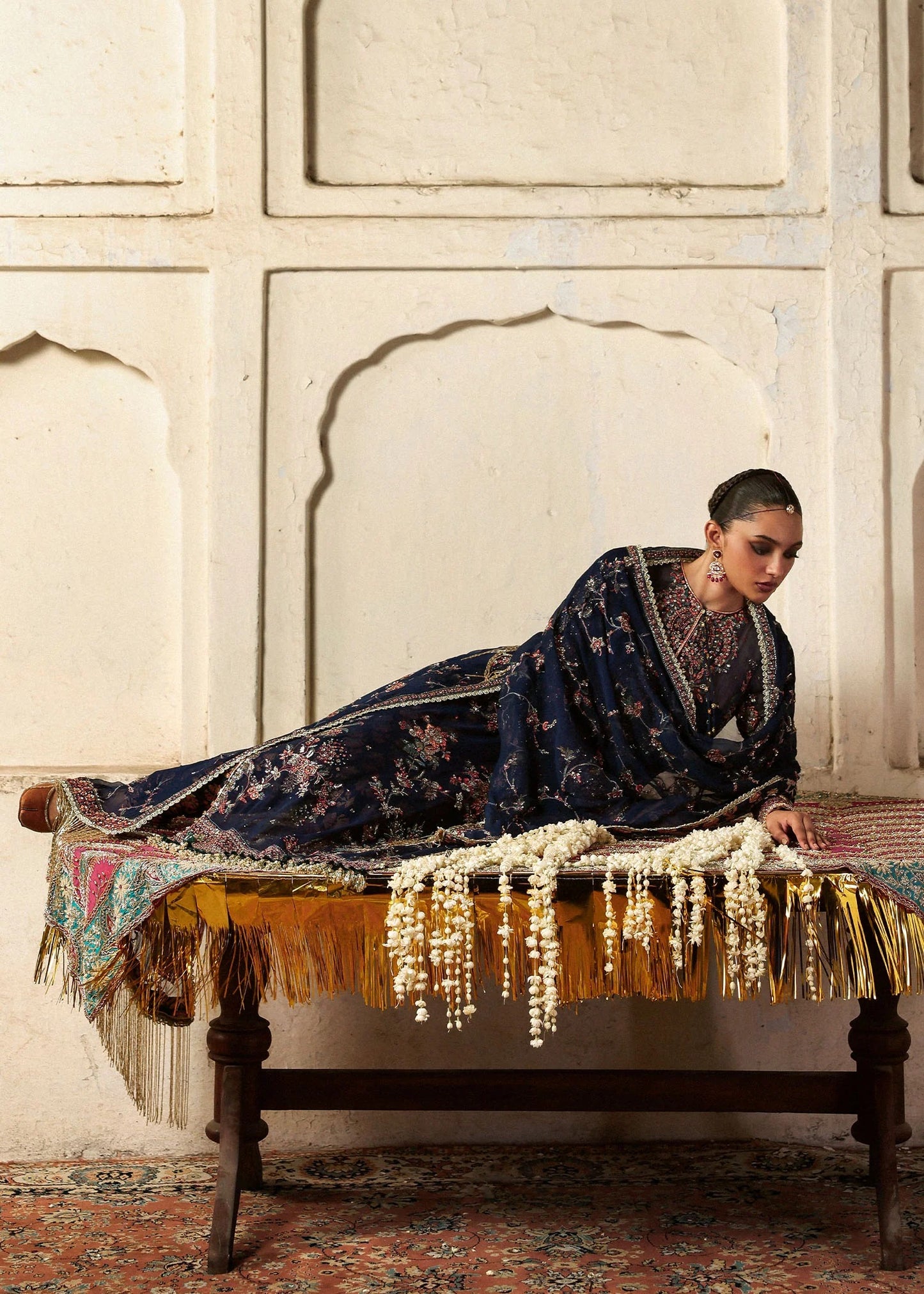 Elegant navy blue chiffon shirt with rich embroidery, silk churidar, and chiffon dupatta. Unstitched festive outfit blending modern grace and timeless charm.