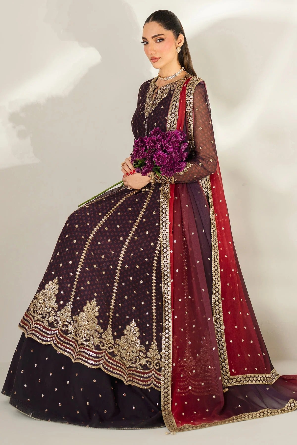 Intricately embroidered chiffon suit with digital prints, bordered dupatta, and raw silk bottom—crafted for timeless elegance and formal sophistication.