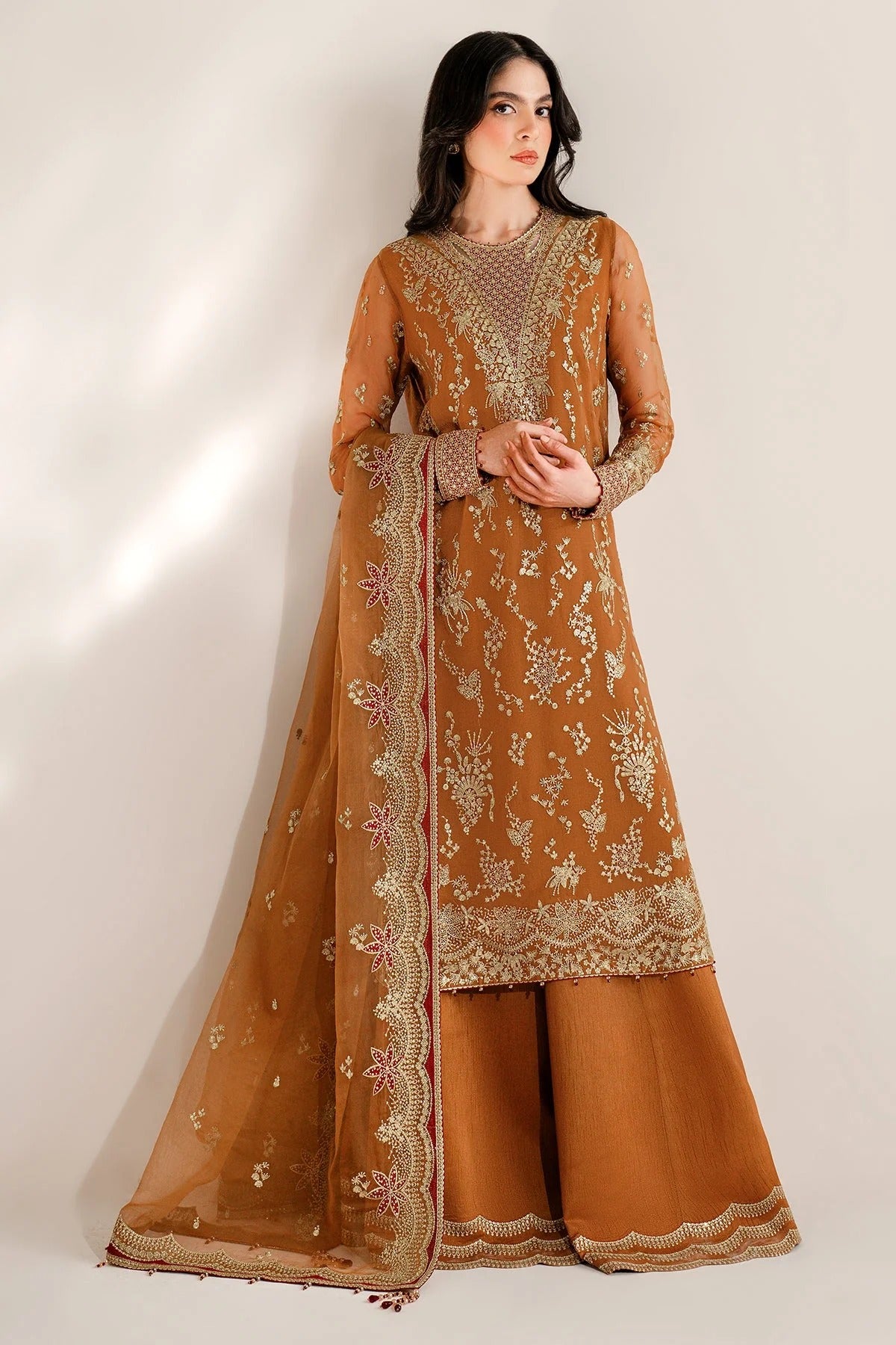 Chiffon and rawsilk elegance with intricate embroidery and organza dupatta. Ideal for formal wear and events. Make a bold style statement in UC-3077.