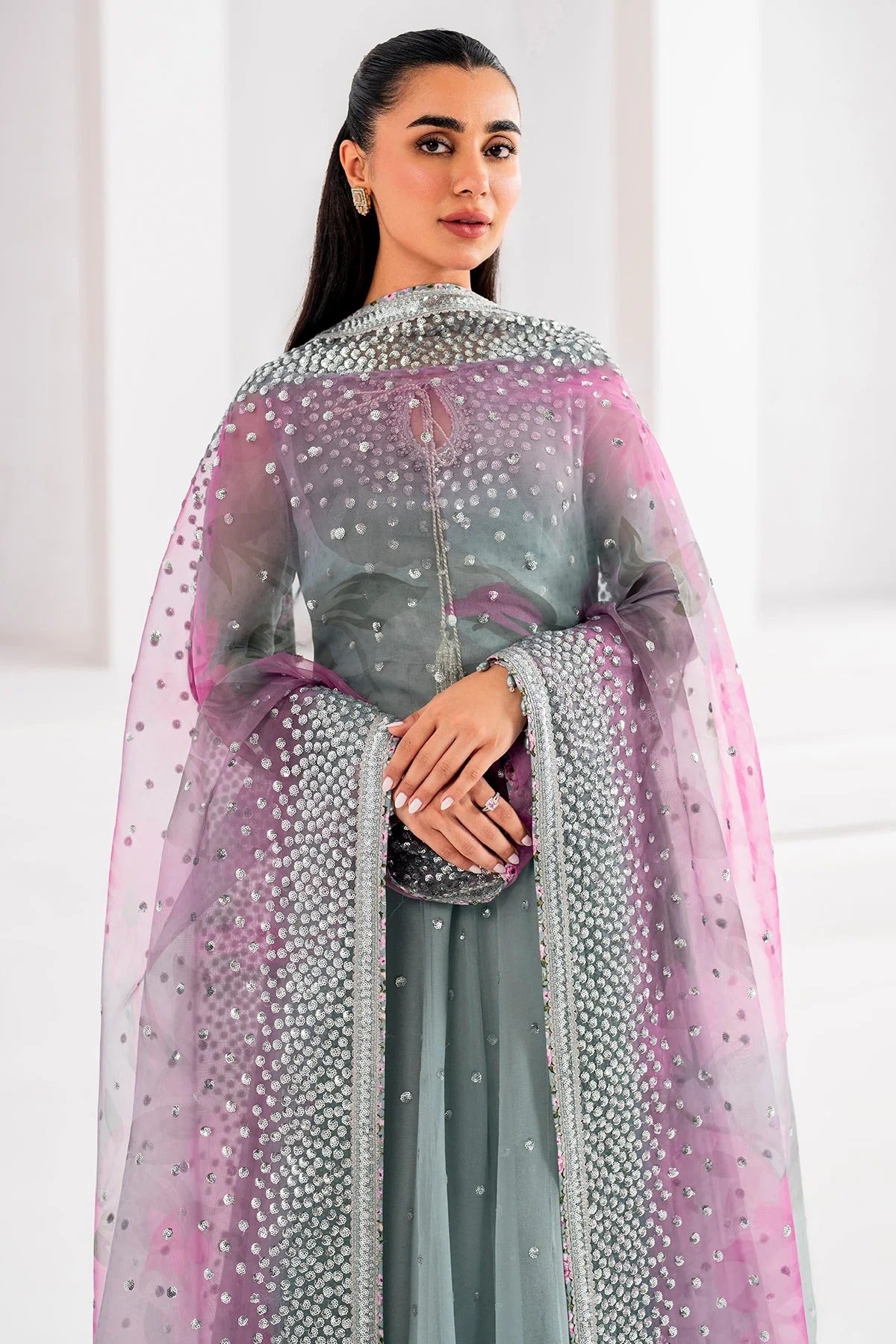 UC-3062 blends embroidered chiffon with digital prints, organza dupatta, and rawsilk trouser—crafted for elegance and perfect for formal occasions.