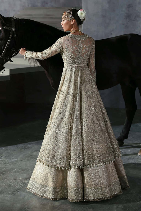 Elegant khaddi net suit featuring hand-embellished panels, embroidered dupatta with four-side border, and jamavar trouser for a timeless festive look.