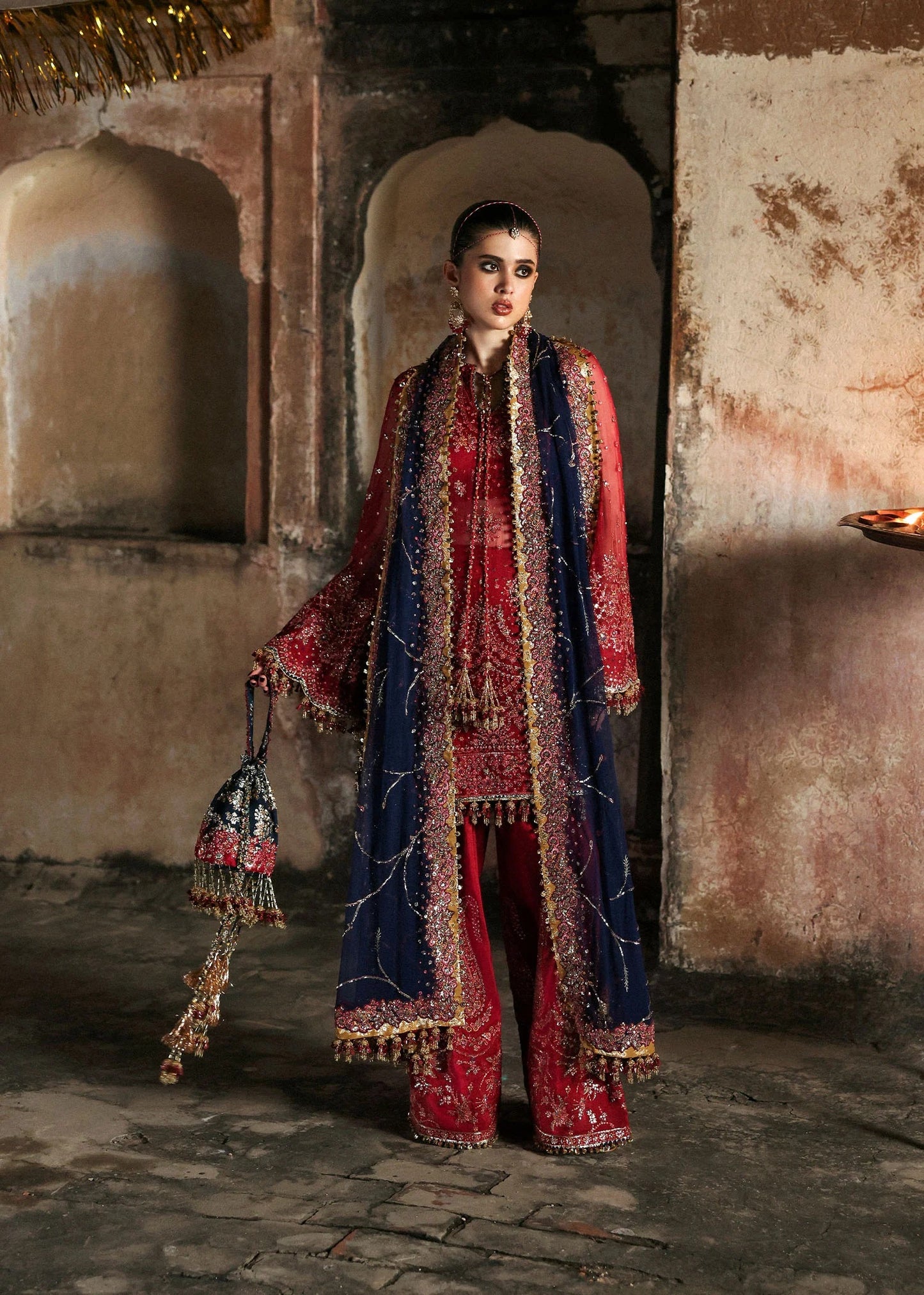 Stunning cherry red chiffon shirt with rich embroidery, silk shalwar, and chiffon dupatta. Unstitched festive outfit radiating elegance and timeless grace.
